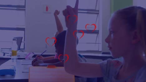 Animation-of-red-hearts-over-diverse-schoolchildren-in-classroom