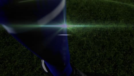 Animation-Von-Lichtspuren-über-Einem-Fußballspieler,-Der-Im-Stadion-Den-Ball-Kickt