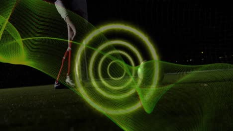 Animation-of-spiral-light-trail-against-mid-section-of-male-soccer-player-practicing-soccer