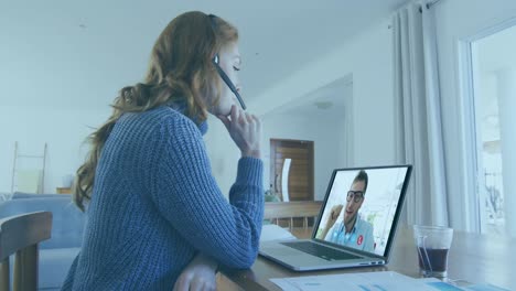 Animation-of-thunder-over-caucasian-woman-having-a-video-call-on-laptop-at-home