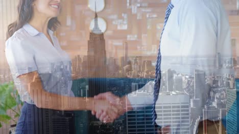 Composite-video-of-diverse-businessman-and-businesswoman-shaking-hands-over-cityscape-at-office