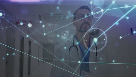 Animation-of-network-of-connections-over-caucasian-male-doctor-walking-on-corridor