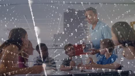 Animation-of-binary-coding-over-caucasian-male-teacher-teaching-group-of-diverse-students-at-school