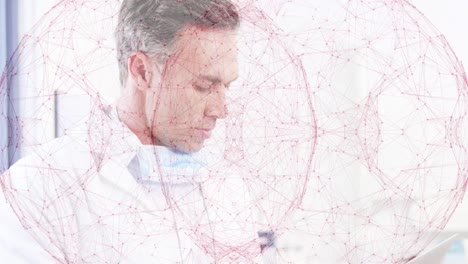 Animation-of-globe-of-network-of-connections-over-portrait-of-caucasian-male-doctor-using-laptop