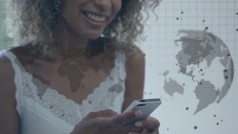 Animation-of-globe-and-world-map-over-biracial-woman-using-smartphone