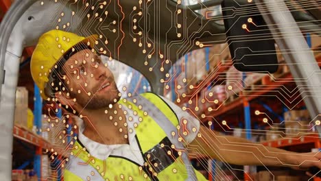 Animation-of-integrated-circuit-over-happy-male-caucasian-warehouse-worker