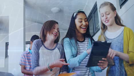 Animation-of-financial-graph-over-happy-diverse-girls-using-tablet-at-school