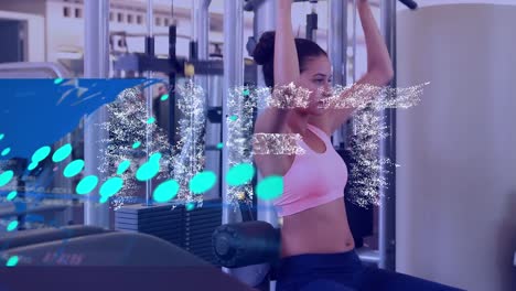 Animation-of-nft-and-financial-graphs-over-biracial-woman-at-gym