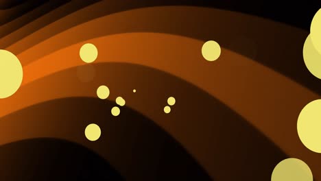 Animation-of-orange-dots-falling-on-orange-wave-on-black-background