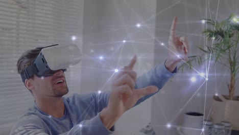 Animation-of-network-of-connections-over-caucasian-man-using-vr-headset