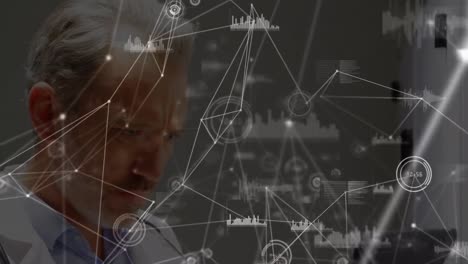 Animation-of-network-of-connections-over-thoughtful-caucasian-male-doctor-using-digital-tablet