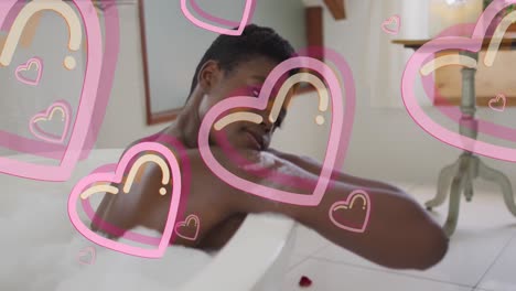Animation-of-heart-icons-over-african-american-woman-taking-bath