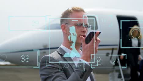 Animation-of-profile-icons-over-caucasian-businessman-talking-on-smartphone-at-the-airport