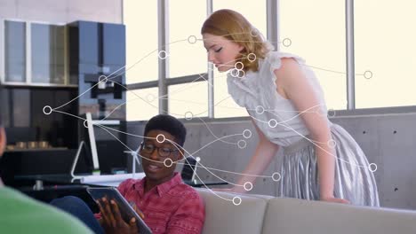 Animation-of-network-of-connections-over-diverse-male-and-female-colleagues-using-digital-tablet