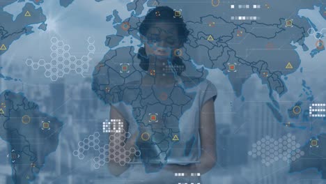 Animation-of-world-map-and-data-processing-over-african-american-businesswoman-using-tablet