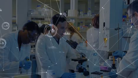 Network-of-connections-against-group-of-diverse-male-and-female-scientists-working-at-the-laboratory