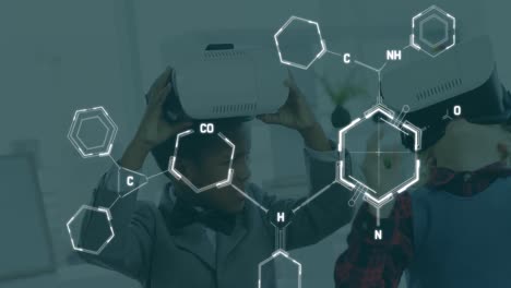 Animation-of-chemical-formulas-over-african-american-boy-using-vr-headset