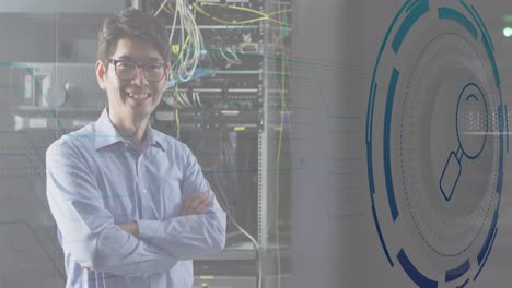 Animation-of-data-processing-over-happy-asian-male-worker-in-server-room