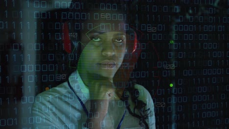 Animation-of-data-processing-over-african-american-female-server-room-worker-using-headphones