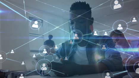 Animation-of-network-of-connections-over-happy-african-american-boy-using-tablet-at-school