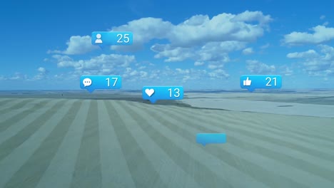 Animation-of-social-media-notification-icons-over-agricultural-landscape