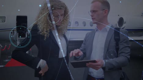 Animation-of-connections-over-caucasian-businesspeople-with-tablet-in-front-of-plane