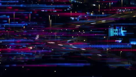 Animation-of-blue-and-pink-lines-moving-over-blurred-night-cityscape