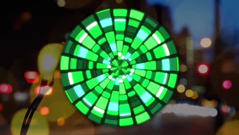 Animation-of-globe-made-of-green-lights-rotating-over-blurred-night-cityscape