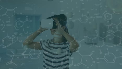 Animation-of-chemical-formulas-over-caucasian-girl-in-vr-headset