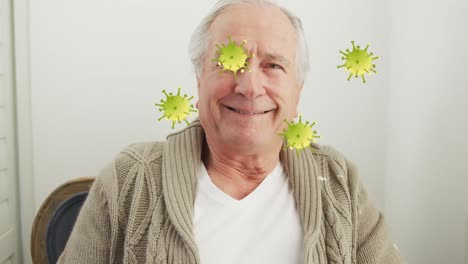Animation-of-virus-cells-over-senior-caucasian-man-smiling
