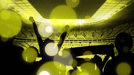 Animation-of-yellow-dots-over-peoples-silhouette-and-sport-stadium