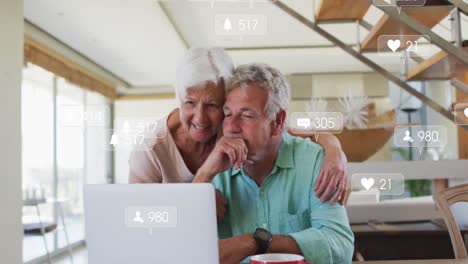 Animation-of-falling-icons-over-caucasian-senior-couple-using-laptop