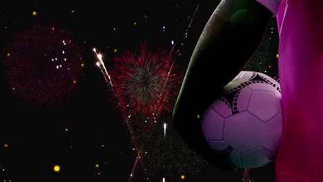 Animation-of-caucasian-male-soccer-player-with-football-over-fireworks