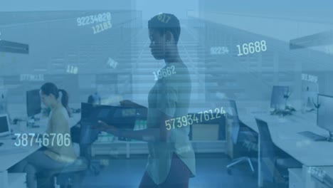 Animation-of-numbers-over-african-american-woman-in-office