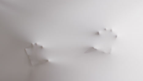Video-of-shapes-of-hands-and-head-moving-on-white-background