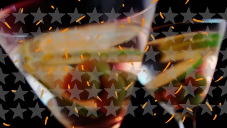Animation-of-stars-over-glasses-of-champagne