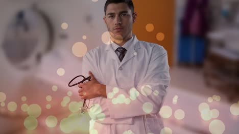 Animation-of-spots-over-caucasian-male-doctor-with-stethoscope