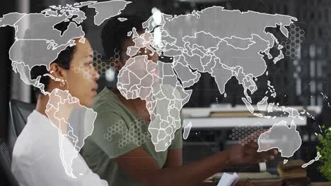 Animation-of-world-map-over-diverse-business-people-in-office
