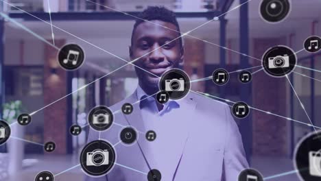 Animation-of-network-of-connections-over-happy-african-american-businessman-with-smartphone