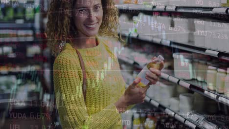 Animation-of-data-processing-over-happy-caucasian-woman-in-shop
