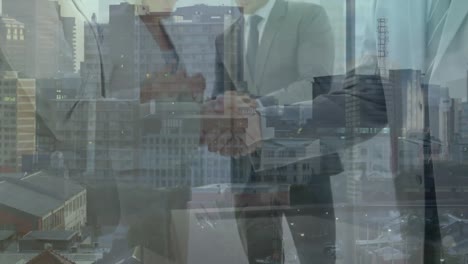 Animation-of-diverse-business-people-over-cityscape