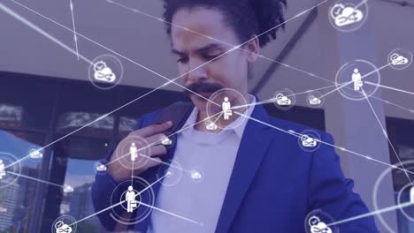 Animation-of-network-of-connections-over-biracial-businessman-using-tablet-on-street