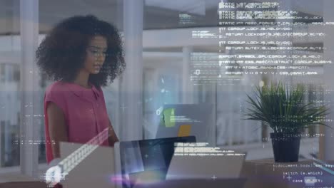 Animation-of-data-processing-over-biracial-woman-with-laptop-in-office