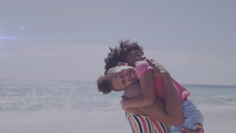 Animation-of-light-trails-over-african-american-woman-and-her-daughter-embracing-at-beach