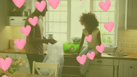 Animation-of-heart-icons-over-african-american-father-and-daughter-segregating-waste