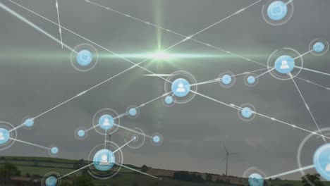 Animation-of-network-of-connections-with-people-icons-over-wind-turbines