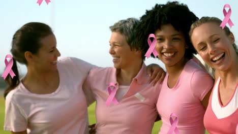 Animation-of-pink-cancer-ribbons-over-diverse-women-embracing