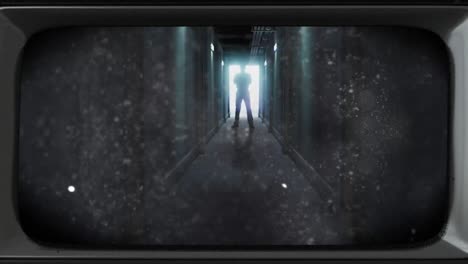 Animation-of-damaged-film-of-scary-backlit-figure-in-doorway-at-end-of-dark-corridor