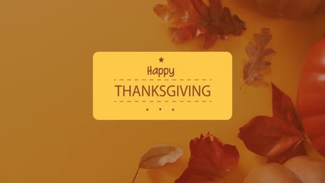 Animation-of-happy-thanksgiving-text-over-autumn-leaves-on-orange-background