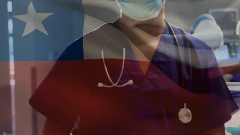 Animation-of-chile-national-flag-over-portrait-of-caucasian-male-surgeon-in-operating-room